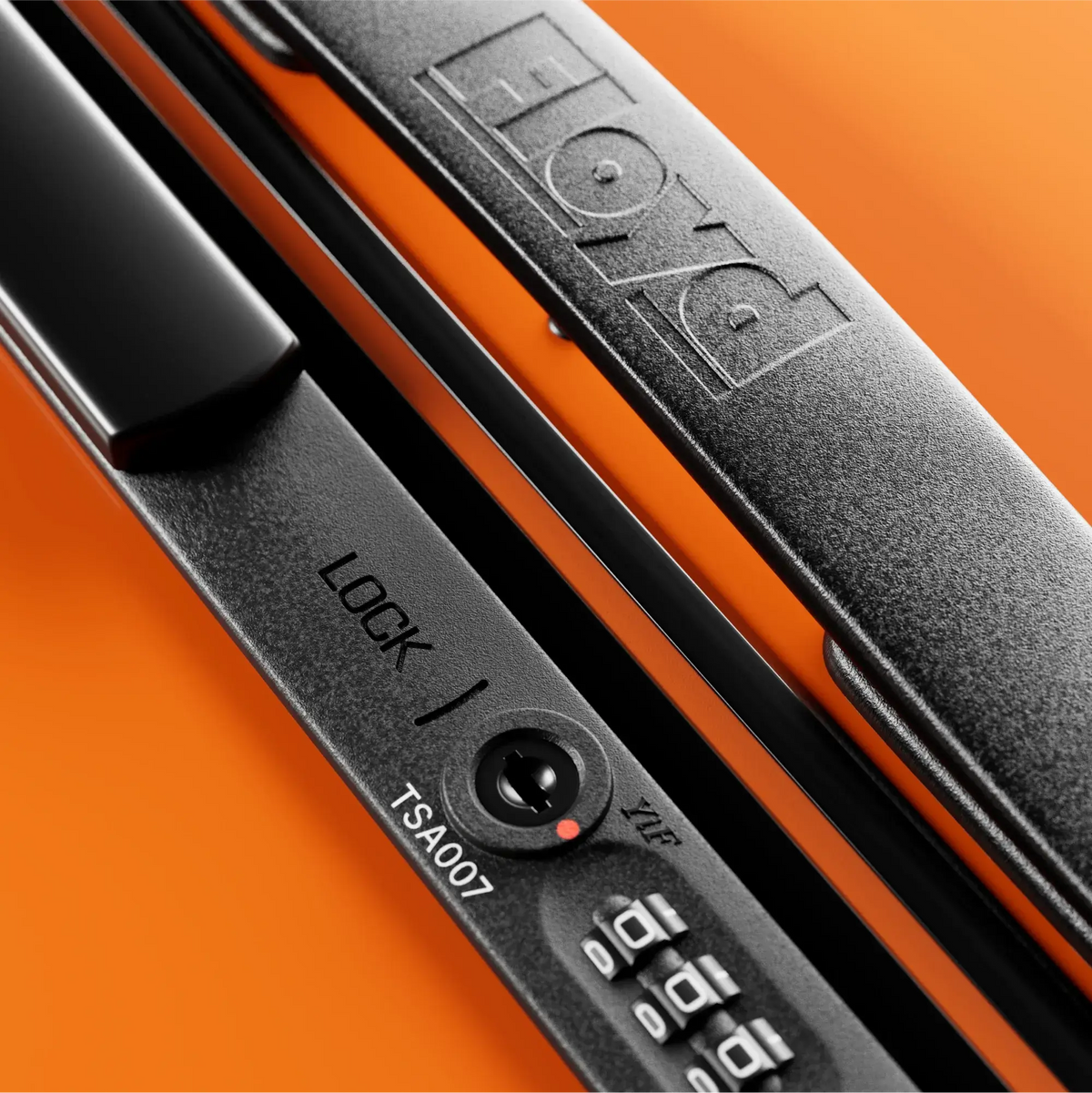 TSA combination lock detail on the Floyd Bold suitcase in Hot Orange