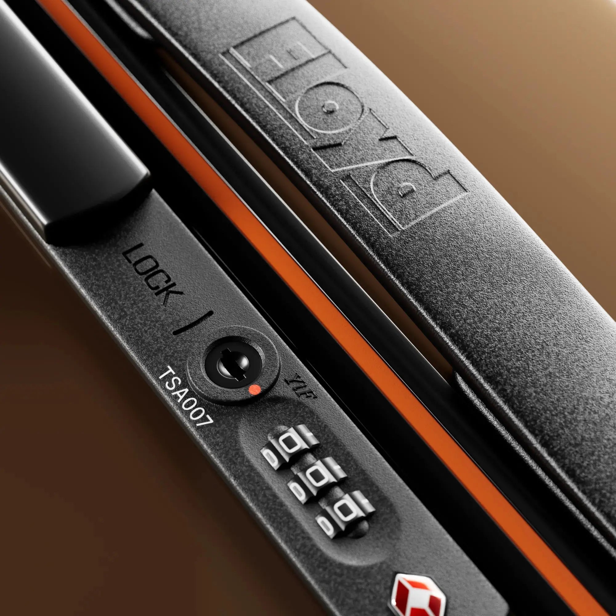 TSA combination lock detail on the Floyd Check-In suitcase in Bronco Brown