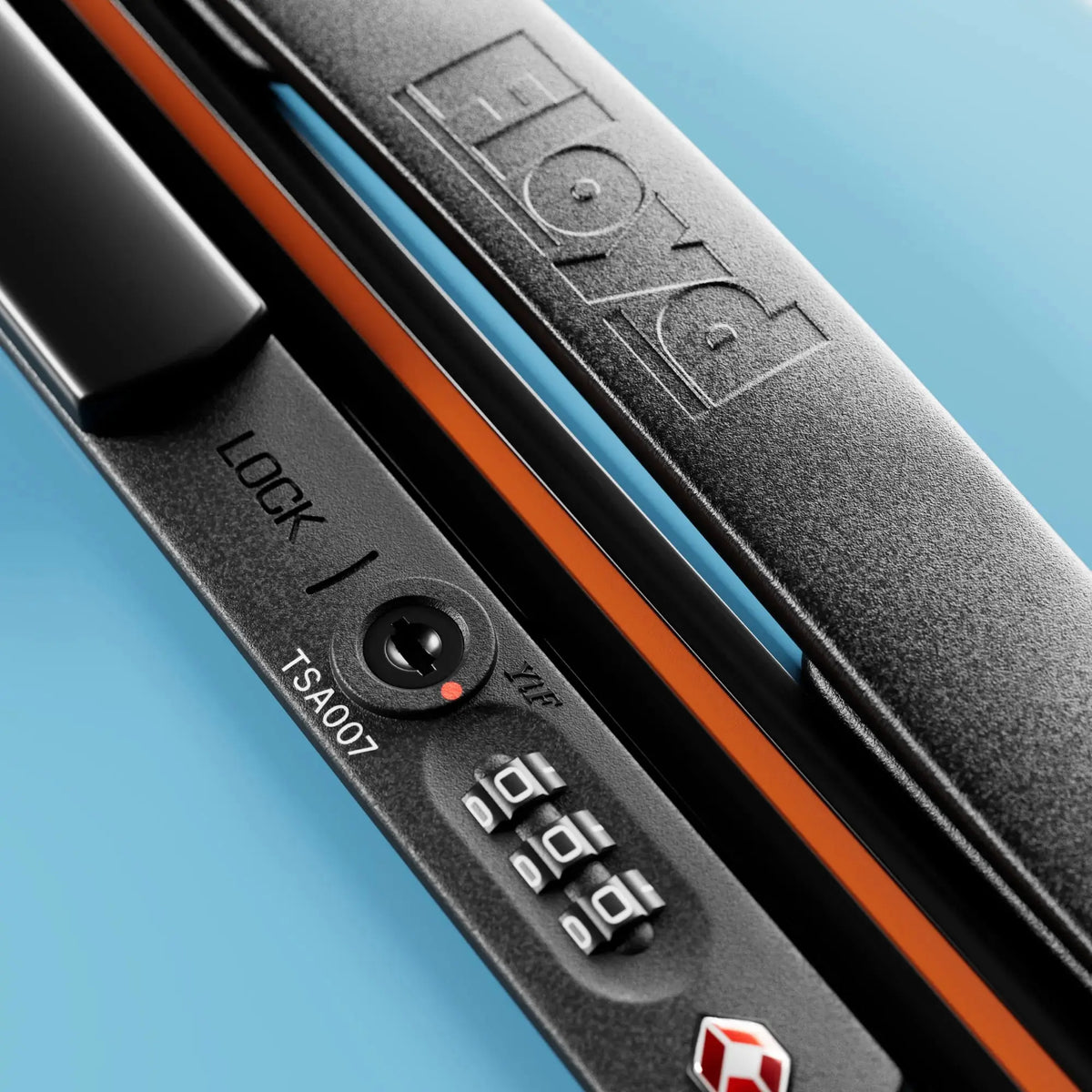 TSA combination lock detail on the Floyd Check-In suitcase in Miami Blue