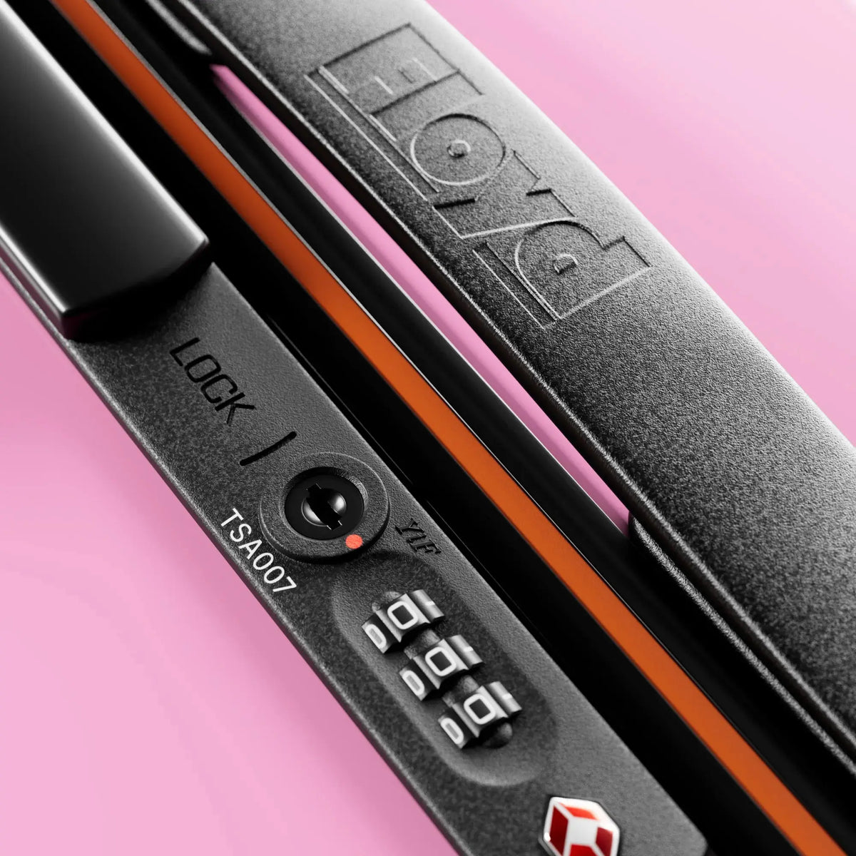 TSA combination lock detail on the Floyd Check-In suitcase in Sugar Pink