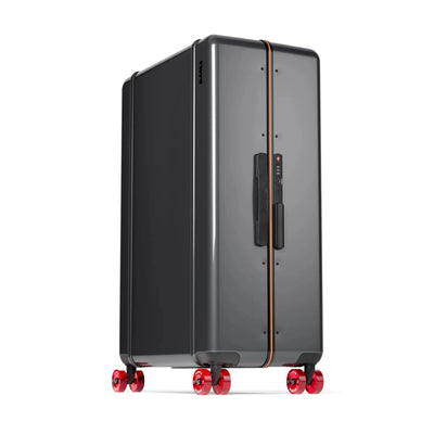 Three-quarter view of the Floyd Trunk suitcase in Tarmac Grey