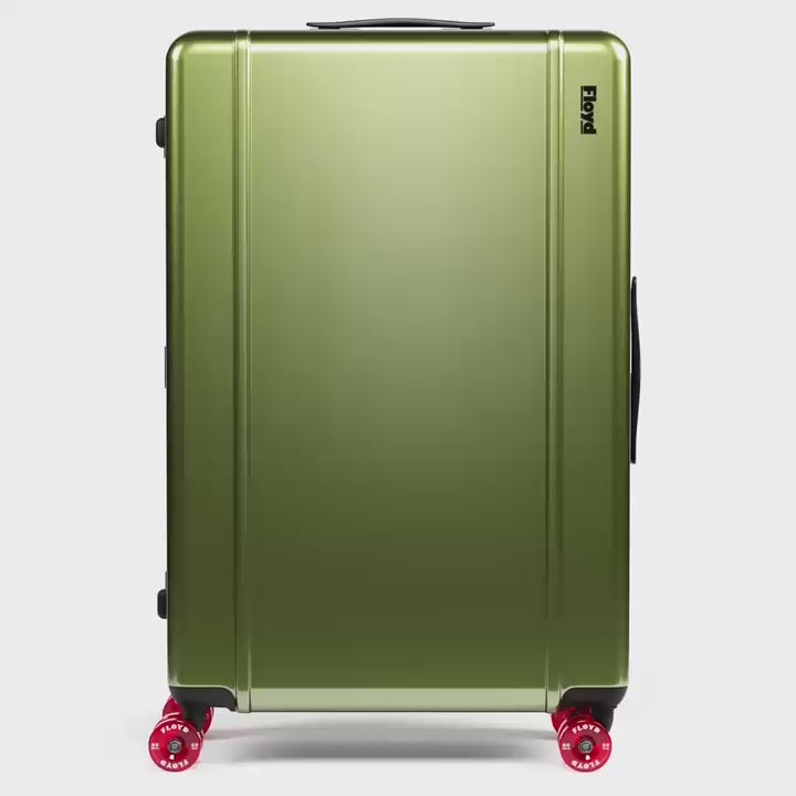 Floyd Trunk suitcase rotating through available colors in a 360-degree view